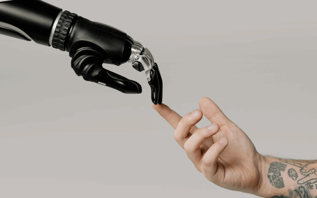 Un robot y un humano tocándose las manos